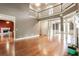 Open living area with hardwood floors and balcony overlooking at 240 Chandler Walk, Loganville, GA 30052