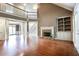 Spacious living area with a brick fireplace and abundant natural light from large windows at 240 Chandler Walk, Loganville, GA 30052