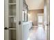 Main bathroom with a tile floor and double doors leading out to the hallway at 240 Chandler Walk, Loganville, GA 30052