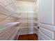 Walk-in pantry features ample shelving, providing convenient storage space at 240 Chandler Walk, Loganville, GA 30052