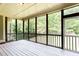 Screened in porch offers relaxing outdoor living while surrounded by the tranquil beauty of the trees at 240 Chandler Walk, Loganville, GA 30052