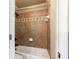 Bathroom featuring tiled tub and shower at 240 Chandler Walk, Loganville, GA 30052