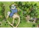 Stunning aerial view of estate with pool, lush landscaping, and charming greenhouse at 4239 Lower Jersey Rd, Covington, GA 30014
