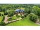 Sprawling estate with a lake view, a three-car garage, and lush landscaping at 4239 Lower Jersey Rd, Covington, GA 30014