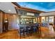 Finished basement's wet bar with dark wood finish, stained glass, and seating at 4239 Lower Jersey Rd, Covington, GA 30014