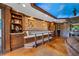 Finished basement with a bar, dining space, and a brick accent wall at 4239 Lower Jersey Rd, Covington, GA 30014