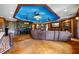 Finished basement with a full bar, a seating area, a media center and a brick fireplace at 4239 Lower Jersey Rd, Covington, GA 30014