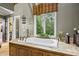 Bathroom suite with large soaking tub on custom wood platform beneath a picture window at 4239 Lower Jersey Rd, Covington, GA 30014