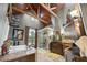 Primary bathroom with vaulted wood ceiling, glass shower, soaking tub, and double sinks at 4239 Lower Jersey Rd, Covington, GA 30014