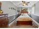 Cozy bedroom with neutral colors, a ceiling fan, and comfortable decor, offering a relaxing space at 4239 Lower Jersey Rd, Covington, GA 30014