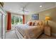 Bedroom featuring a queen-size bed and large windows with natural light at 4239 Lower Jersey Rd, Covington, GA 30014