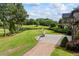 Spacious backyard with lush landscaping and a helicopter pad for easy access at 4239 Lower Jersey Rd, Covington, GA 30014