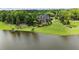 Expansive estate home on a lake with a private dock and meticulously landscaped grounds at 4239 Lower Jersey Rd, Covington, GA 30014