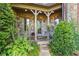 Charming front entrance with stone facade, lush landscaping, and a welcoming entryway at 4239 Lower Jersey Rd, Covington, GA 30014