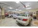 Spacious garage featuring multiple cars, storage, and high ceilings at 4239 Lower Jersey Rd, Covington, GA 30014
