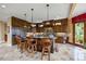 Gourmet kitchen featuring custom cabinets, an island with bar seating, and stainless steel appliances at 4239 Lower Jersey Rd, Covington, GA 30014