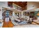 Expansive living room featuring a stone fireplace, hardwood floors, and an open concept design at 4239 Lower Jersey Rd, Covington, GA 30014