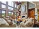 Stunning living room with vaulted ceilings, stone fireplace, and comfortable seating arrangement at 4239 Lower Jersey Rd, Covington, GA 30014
