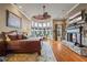Spacious main bedroom with sitting area, fireplace, and a wall of bright windows at 4239 Lower Jersey Rd, Covington, GA 30014