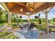 Outdoor patio with scenic views, comfortable seating, and a cozy atmosphere for entertaining at 4239 Lower Jersey Rd, Covington, GA 30014