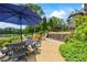 Stone patio features an outdoor table, seating, and water feature with a lake view at 4239 Lower Jersey Rd, Covington, GA 30014