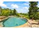 Lush backyard featuring a luxurious swimming pool and spa at 4239 Lower Jersey Rd, Covington, GA 30014