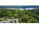 Stunning aerial view showcasing lush green trees, a serene lake, and the charming community at 4571 Academy St, Acworth, GA 30101
