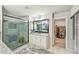 Updated bathroom boasts a glass shower, granite vanity, and a walk-in closet at 4571 Academy St, Acworth, GA 30101