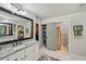 Bathroom with granite countertops, walk-in closet, and separate toilet room at 4571 Academy St, Acworth, GA 30101