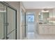 Elegant bathroom featuring double vanity, granite countertops, a glass-enclosed shower, and tiled flooring at 4571 Academy St, Acworth, GA 30101