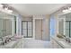 Modern bathroom with double sinks, granite countertops, and a glass-enclosed shower with tile flooring at 4571 Academy St, Acworth, GA 30101