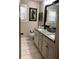 Bright bathroom featuring granite countertops, stylish fixtures, and tile flooring at 4571 Academy St, Acworth, GA 30101