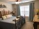 Comfortable bedroom with wood headboard and light blue walls with a large window at 4571 Academy St, Acworth, GA 30101