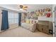 Bedroom with neutral colored walls, a fan, and built-in storage at 4571 Academy St, Acworth, GA 30101