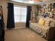 Bright bedroom features a daybed, large window, and personalized wall decor at 4571 Academy St, Acworth, GA 30101