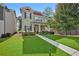 Charming two-story home with manicured lawn, walkway, and inviting covered front porch at 4571 Academy St, Acworth, GA 30101