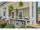 Charming front porch with hanging plants and decorative seating at 4571 Academy St, Acworth, GA 30101