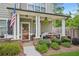 Charming front porch with stone accents, cozy seating, and manicured landscaping at 4571 Academy St, Acworth, GA 30101
