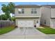 Exterior view of a two-car garage with a driveway at 4571 Academy St, Acworth, GA 30101