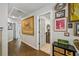 Hardwood floors, grey doors, and art hanging are just a few features of this charming hallway at 4571 Academy St, Acworth, GA 30101