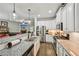 A modern kitchen with stainless steel appliances, granite countertops, and view to the living room at 4571 Academy St, Acworth, GA 30101