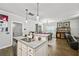 Spacious kitchen with granite countertops, stainless appliances, and an island that opens to the living room at 4571 Academy St, Acworth, GA 30101
