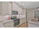 Beautiful kitchen featuring granite countertops, stainless steel appliances, and stylish white cabinetry at 4571 Academy St, Acworth, GA 30101