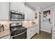Modern kitchen features stainless steel appliances, granite countertops, and white subway tile backsplash at 4571 Academy St, Acworth, GA 30101