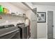 Laundry room featuring a newer washer and dryer and shelving at 4571 Academy St, Acworth, GA 30101