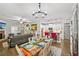Open-concept living space with a dining area, kitchen, fireplace, and hardwood flooring at 4571 Academy St, Acworth, GA 30101