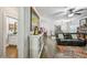 A spacious living room that opens to a breakfast nook and kitchen, and a view to a powder room at 4571 Academy St, Acworth, GA 30101