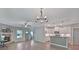 Open-concept living space featuring hardwood floors, a fireplace, and seamless flow into the modern kitchen at 4571 Academy St, Acworth, GA 30101