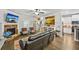 A stylish living room featuring a fireplace, TV, and an open-concept design with view to the kitchen at 4571 Academy St, Acworth, GA 30101