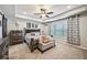 Serene main bedroom retreat with tray ceilings, neutral decor, and ample natural light at 4571 Academy St, Acworth, GA 30101